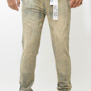 Person wearing distressed light-colored jeans with a visible brand tag on a white background