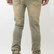 Person wearing light-colored distressed jeans on a white background