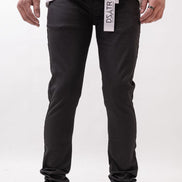 Person wearing black pants with a visible brand label on a white background