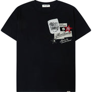 A black short-sleeve crewneck t-shirt featuring a graphic collage print on the left chest with white, red, and black elements, displayed against a solid white background.