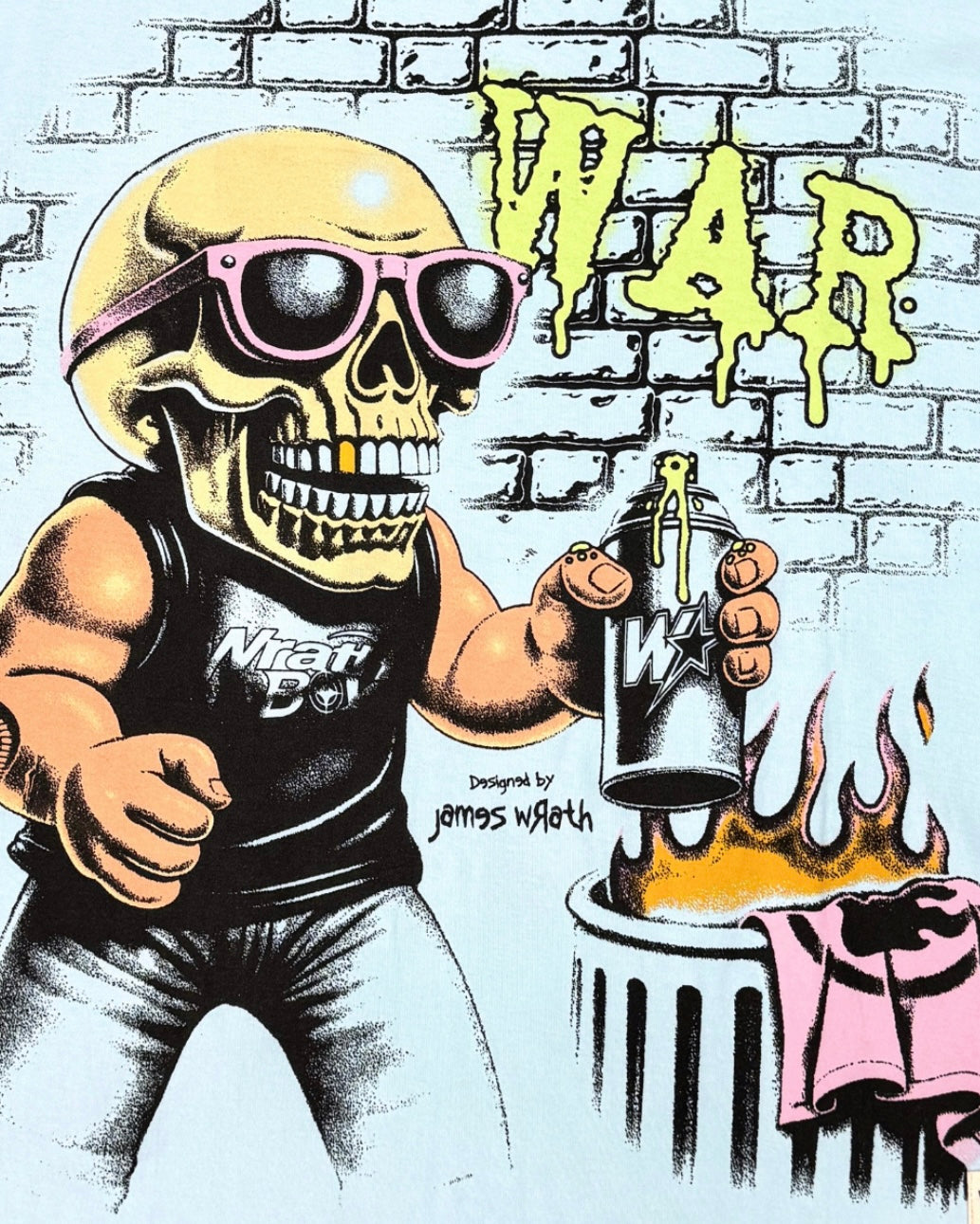 A stylized graphic print featuring a cartoon skull wearing pink sunglasses and a black tank top with 'War' on the chest, holding a spray can in front of a brick wall with large yellow 'WAR' lettering and flames above a pink shirt.