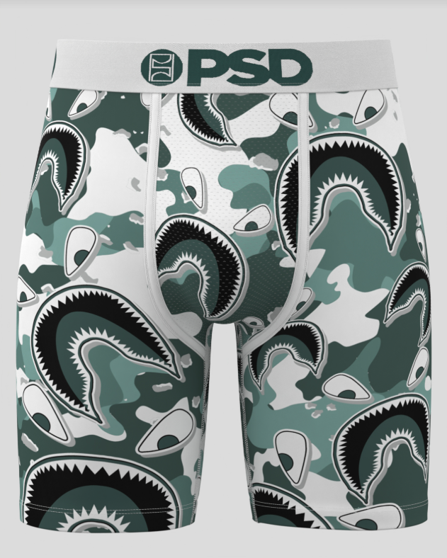 Green briefs with shark pattern and 'PSD' branding on a white background