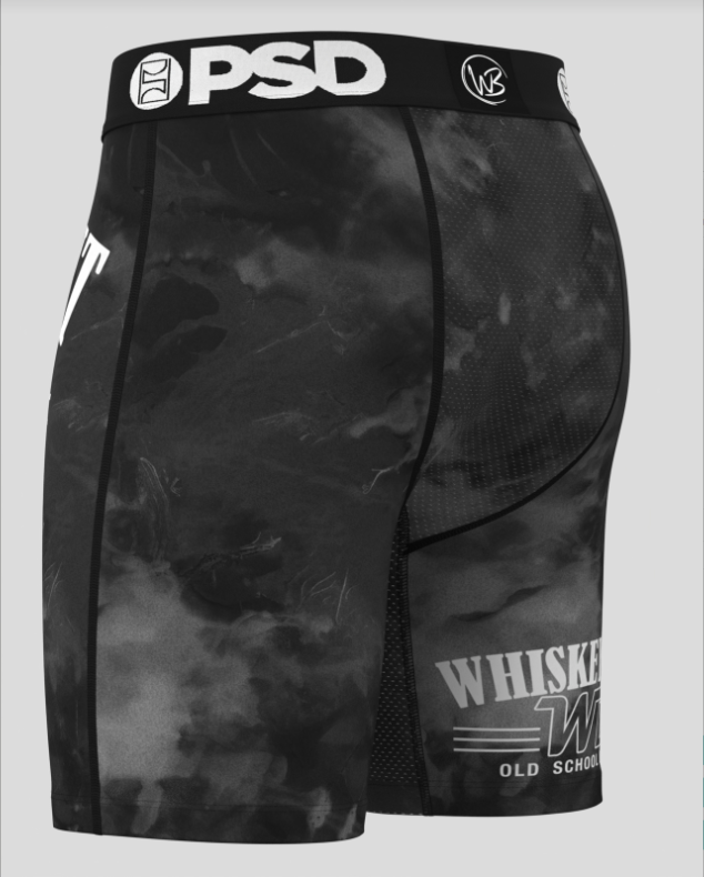 Black camouflage athletic briefs with 'PSD' and 'Whisker' branding on a gray background
