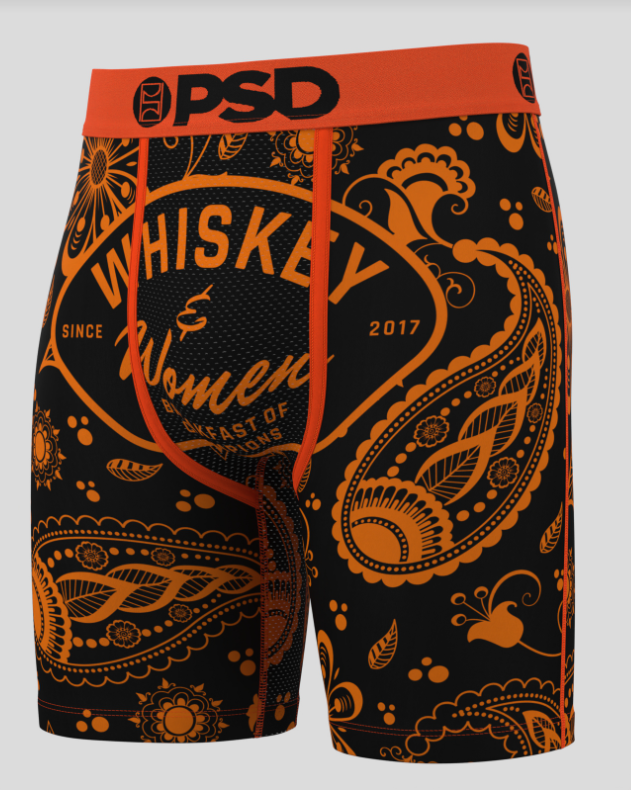 Black and orange patterned briefs with 'Whiskey Women' branding on a gray background