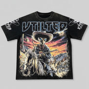 Black t-shirt with a graphic design of a cowboy and horse on a gray background
