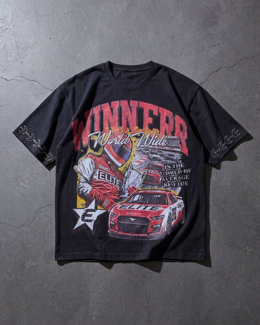 Black t-shirt with racing-themed graphic on a gray surface