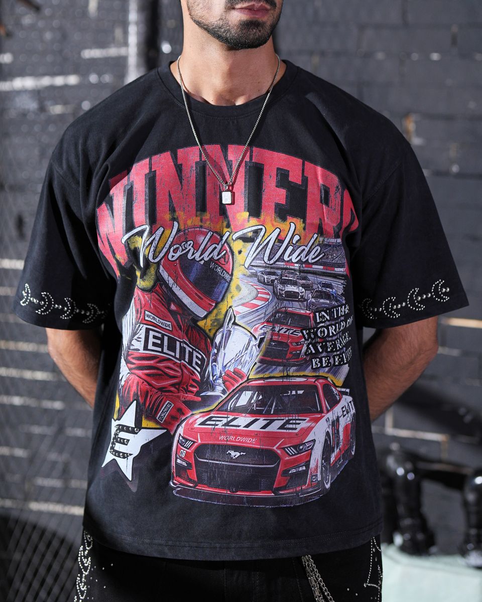 Person wearing a black t-shirt with racing-themed graphics and text.