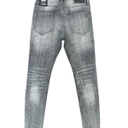 Gray washed denim jeans shown from the back, featuring a faded gray wash, classic five-pocket design, and a black brand patch on the back waistband.