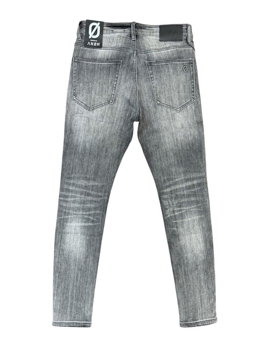 Gray washed denim jeans shown from the back, featuring a faded gray wash, classic five-pocket design, and a black brand patch on the back waistband.