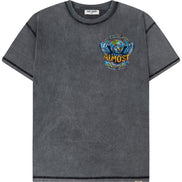 A dark gray mineral-wash short-sleeve t-shirt with a colorful graphic on the left chest featuring a winged globe and the text 'TOUR OF THE WORLD ALMOST SOMEDAY'.