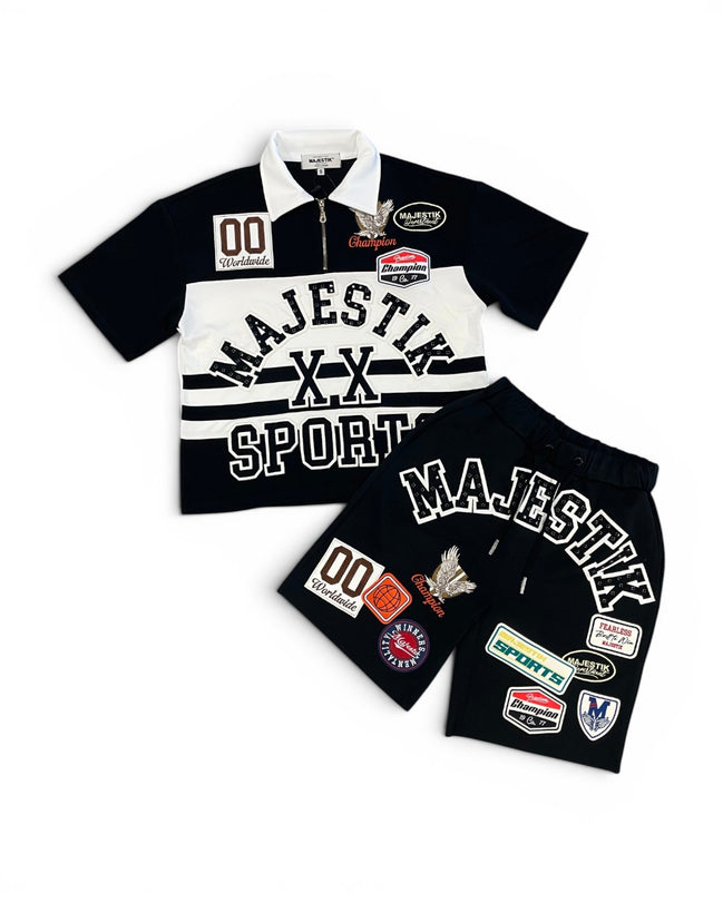 Black and white sports-themed outfit with patches on a white background