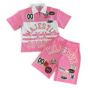 Pink sports outfit with 'Majestik' branding on a white background