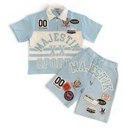 Sports outfit with light blue shirt and shorts featuring 'Majestik' branding on a white background.