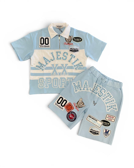 Sports outfit with light blue shirt and shorts featuring 'Majestik' branding on a white background.