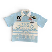 Light blue and white polo shirt with 'Majestik Sports' branding on a white background