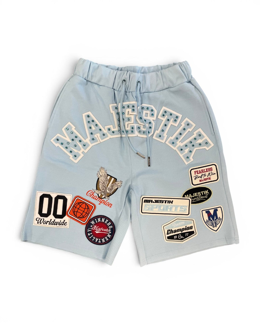 Light blue shorts with various patches on a white background