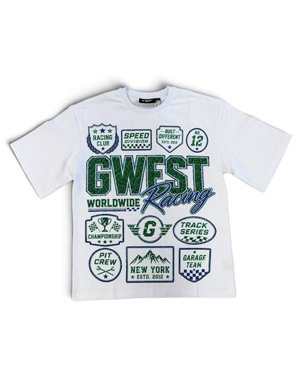 A white short-sleeve t-shirt with a green and blue graphic print featuring the text 'GWEST Worldwide Racing' and various track-themed badges, displayed flat against a white background.