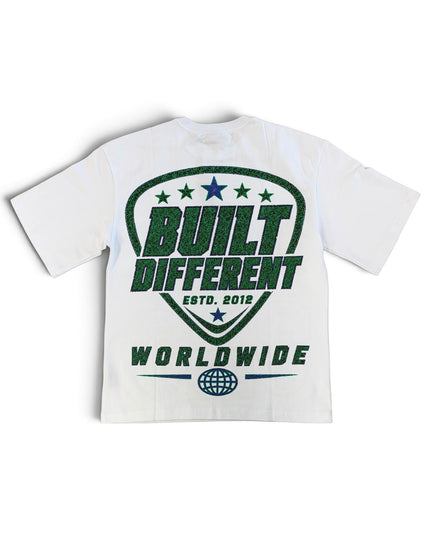 A white short-sleeve t-shirt with a green graphic print on the back. The graphic features a shield design with the words 'BUILT DIFFERENT', 'ESTD.