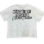 White crop top with black text on a white background