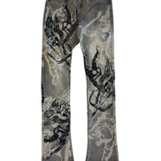 Denim jeans with graphic designs on a white background