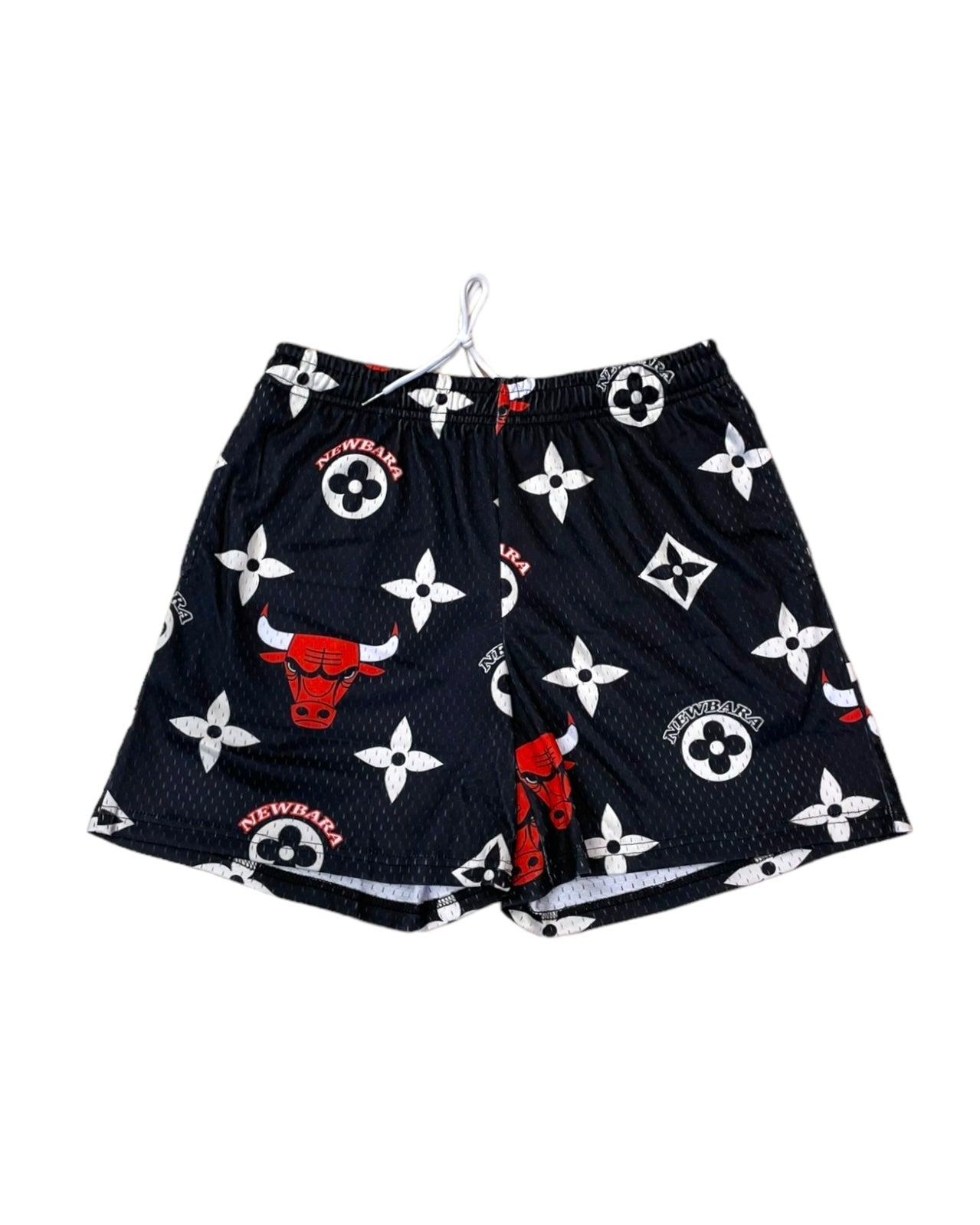 black and white mesh shorts with a red bull on them