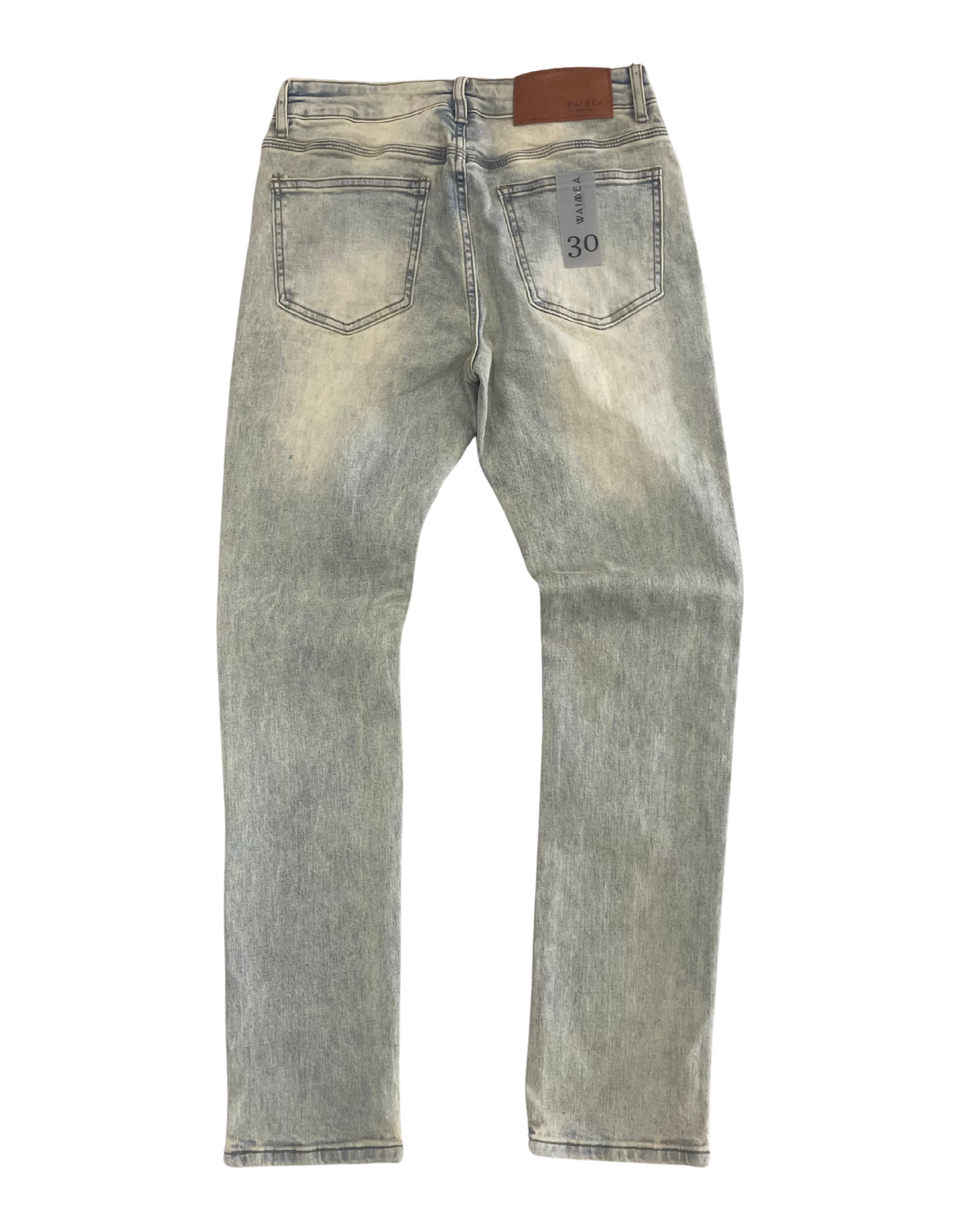 Light blue denim jeans on a white background