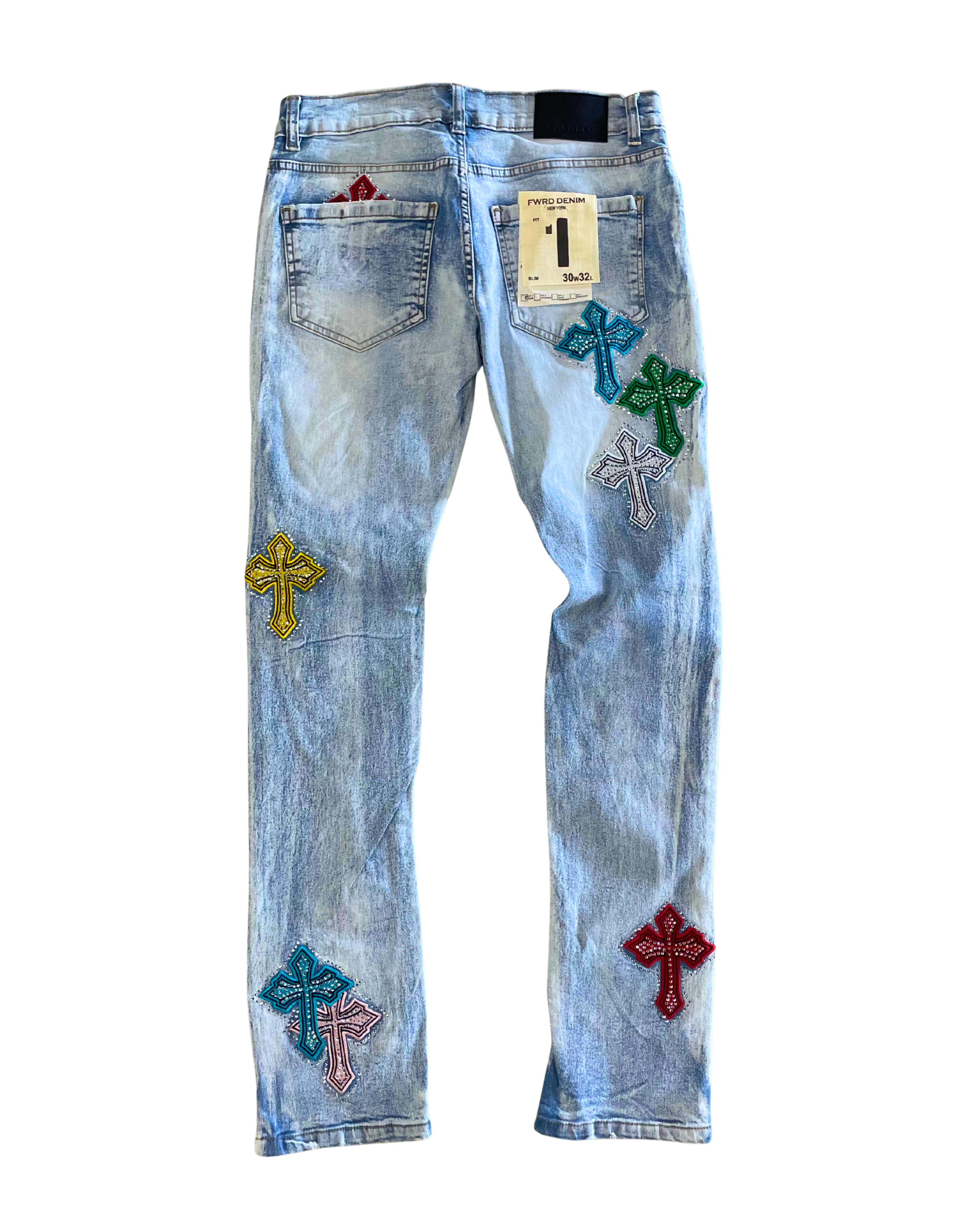 Light blue jeans with colorful cross patches on a white background