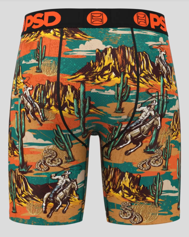 Boxer briefs with a desert landscape design featuring horses, cacti, and mountains on a gray background.