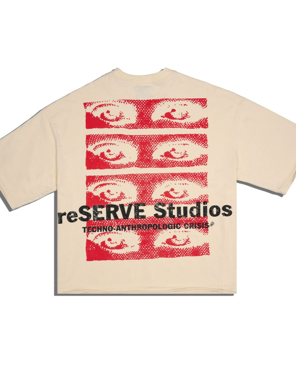 Back of a bone color  t-shirt with red and black graphic design on a white background