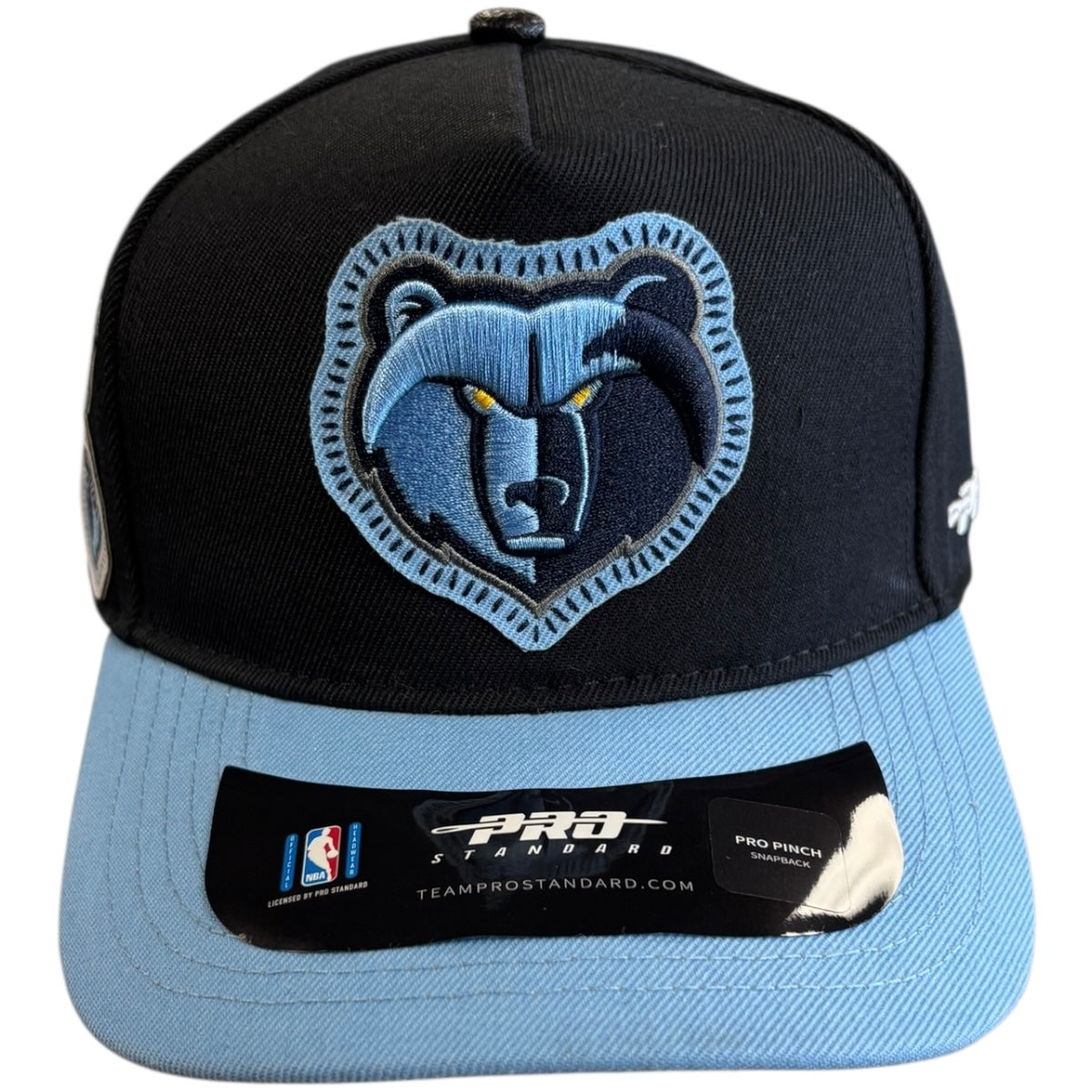 Black and blue cap with bear logo on a white background