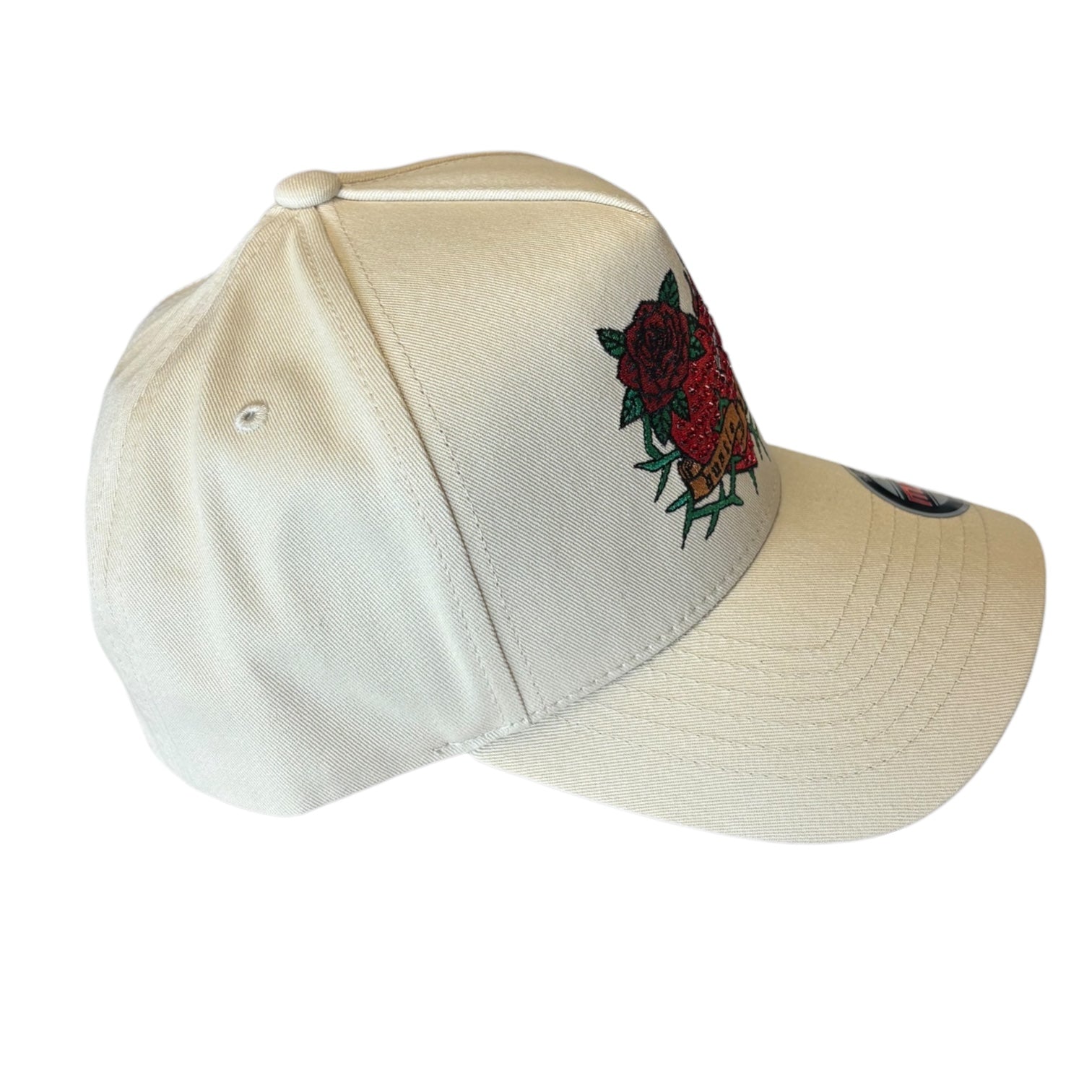White cap with a red rose design on a white background