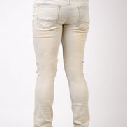 White jeans worn by a person on a white background