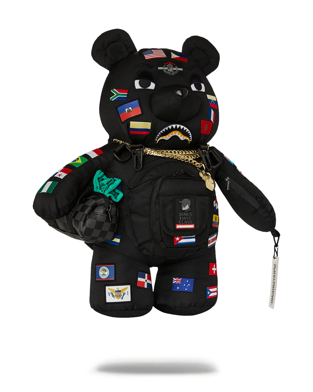Black bear plush toy with flags and backpack on a white background