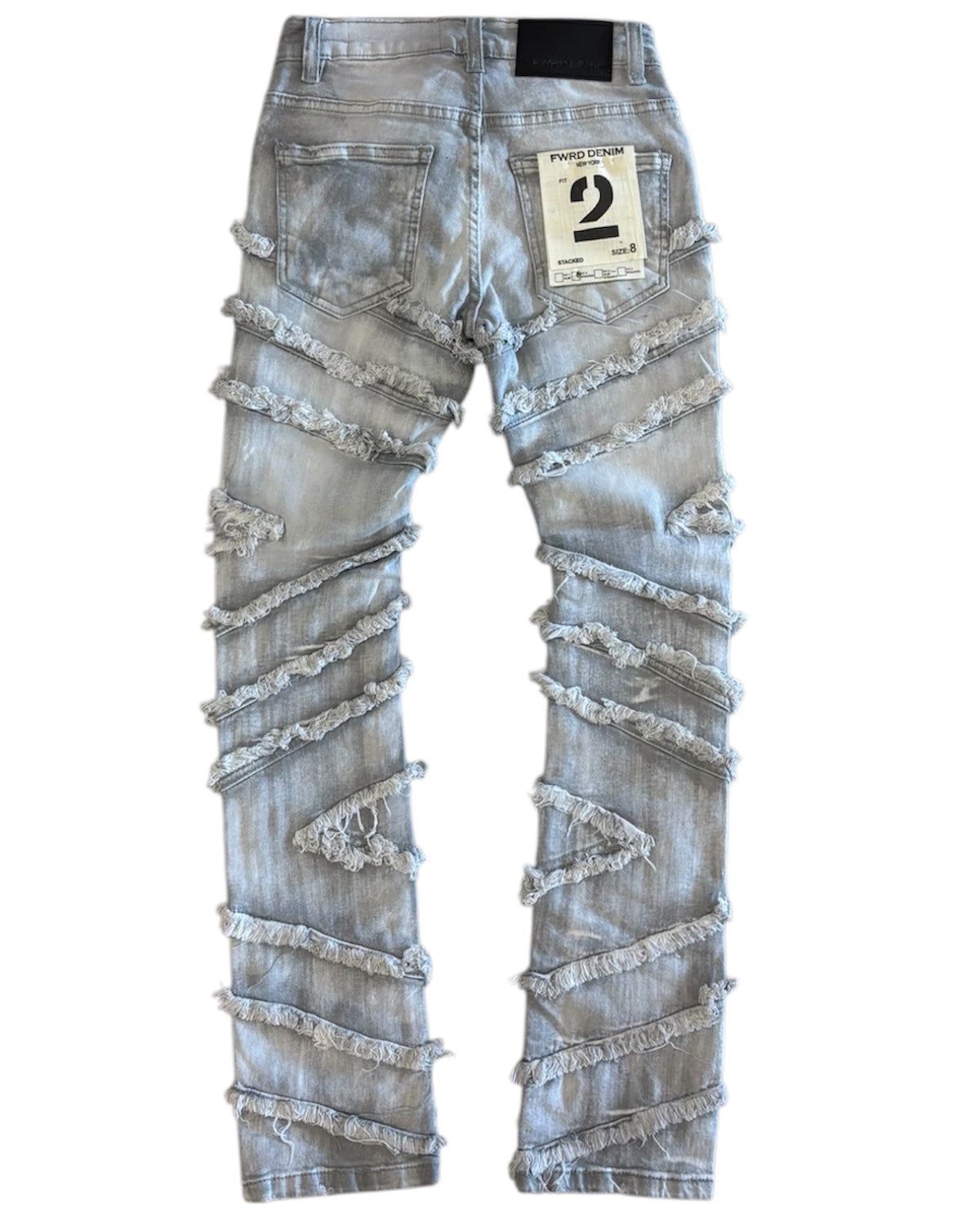 Distressed denim jeans with lace details on a white background