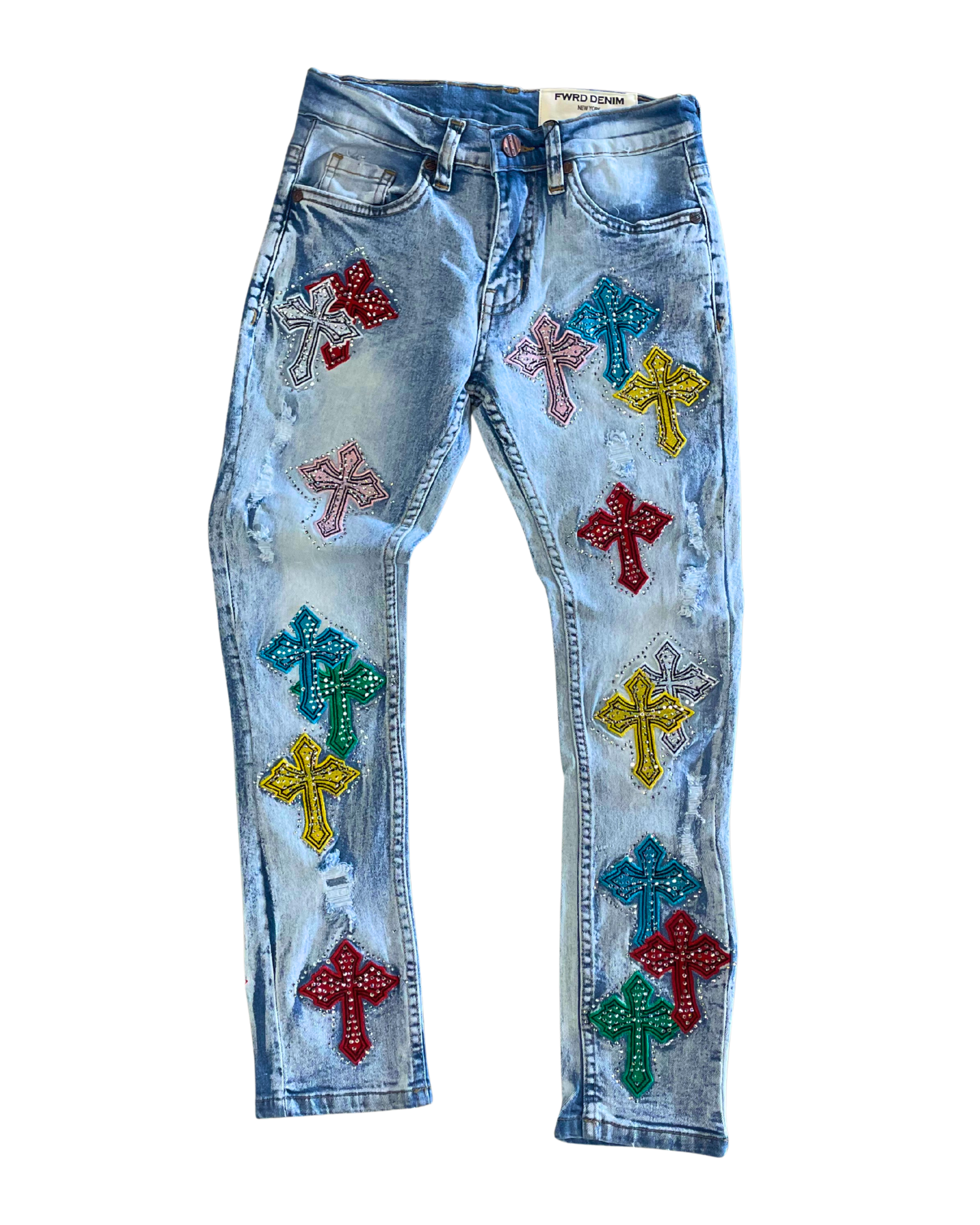 Blue jeans with colorful cross embellishments on a white background