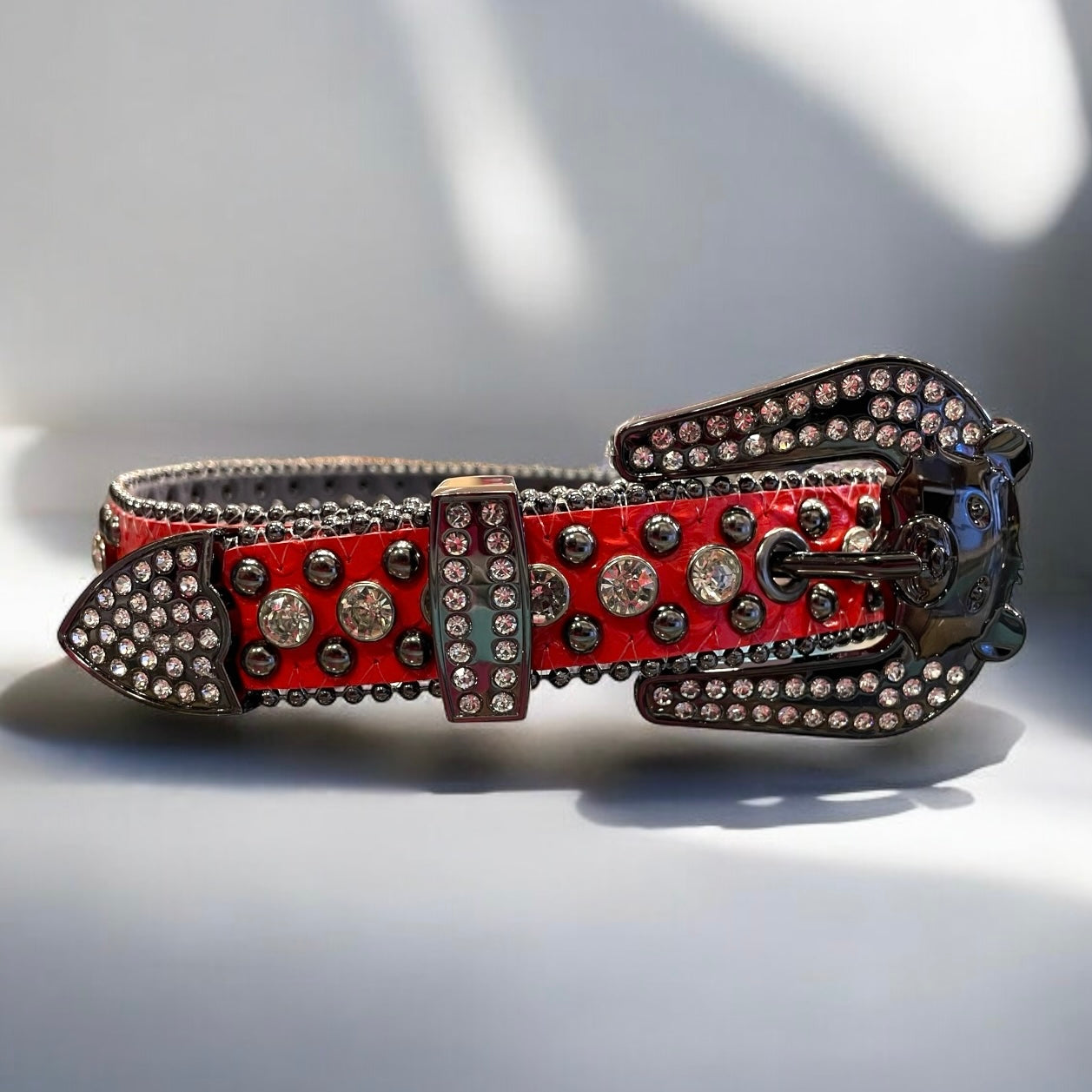 kids red leather belt with white tones