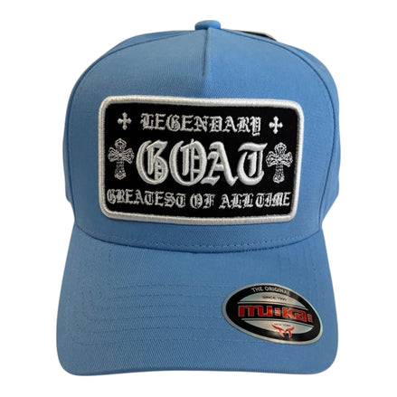 Blue cap with a black patch featuring 'Legendary GOAT Greatest of All Time' text on a white background.