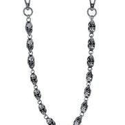 Silver chain with skull designs on a white background