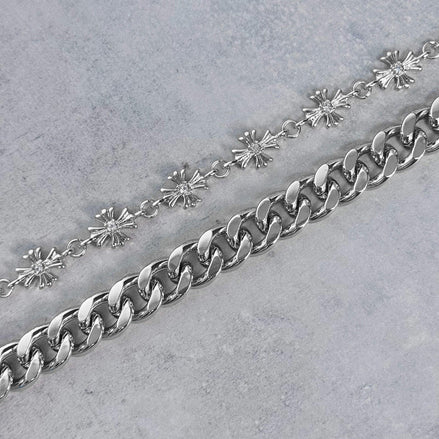 silver chain on a gray surface