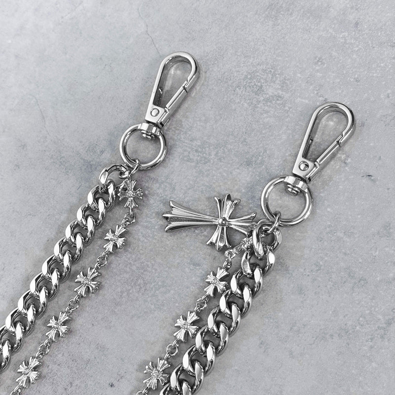 Silver chain with clasp and decorative elements on a gray background