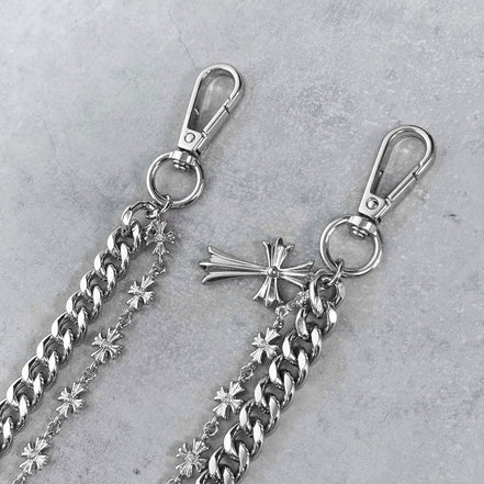 Silver chain with clasp and decorative elements on a gray background