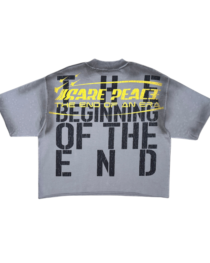 Gray t-shirt with black and yellow text on a white background