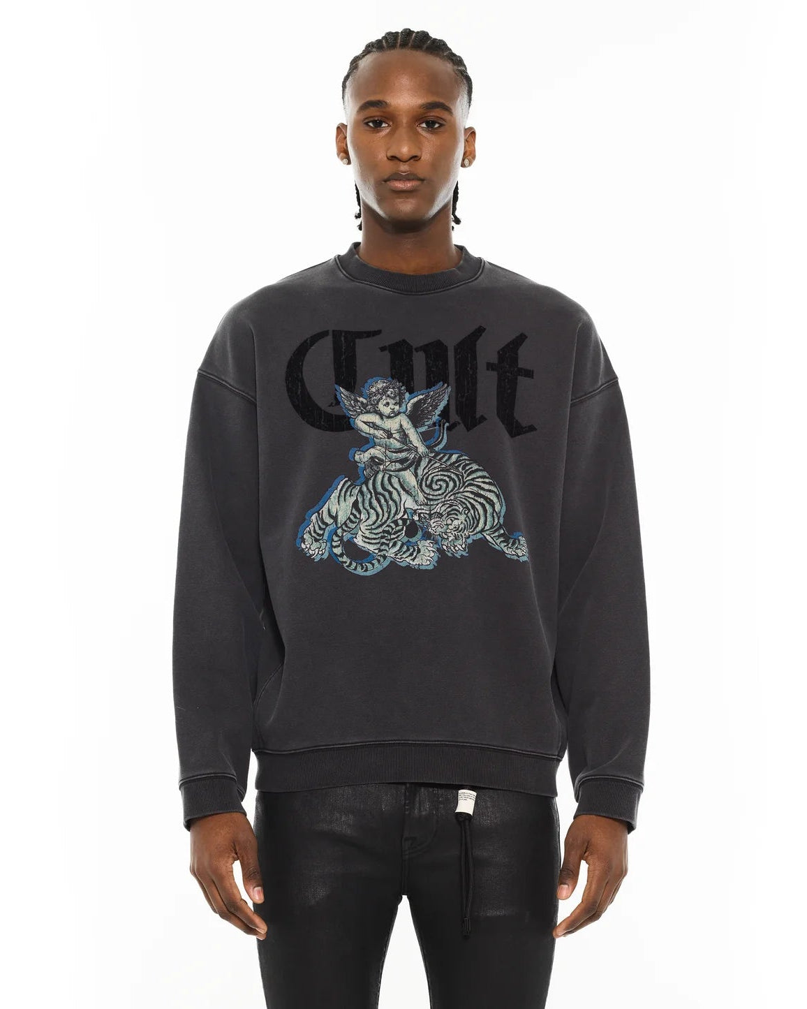 Person wearing a black sweatshirt with a graphic design on a white background