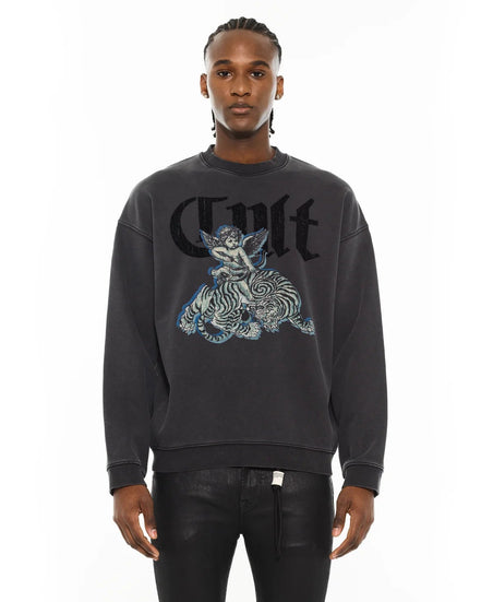 Person wearing a black sweatshirt with a graphic design on a white background