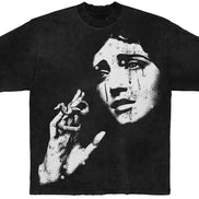 Black t-shirt with a graphic design of a woman's crying face and hand on a white background