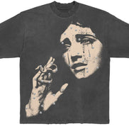 Black t-shirt with a graphic design of a woman's crying face and hand on a white background