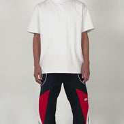 model wearing the Noir pants by EPTM showing off the fit of the pants with minimal styling and posing