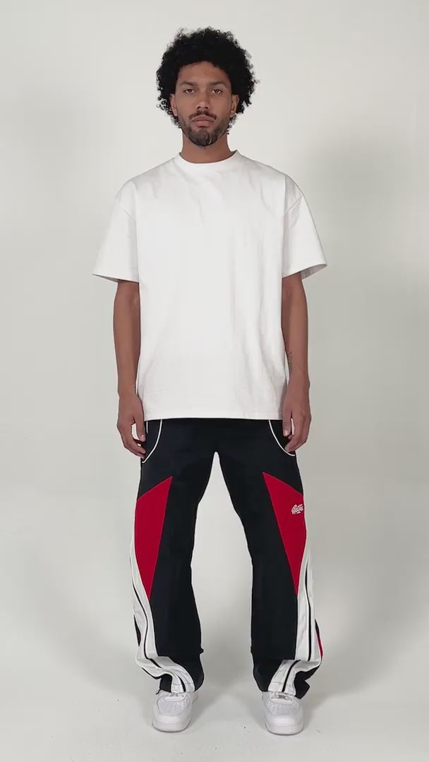 model wearing the Noir pants by EPTM showing off the fit of the pants with minimal styling and posing