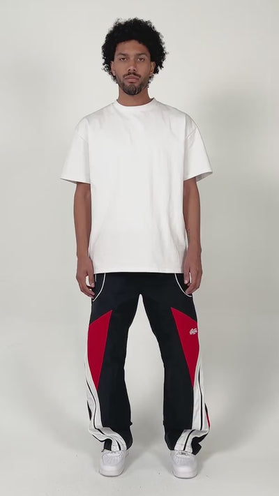 model wearing the Noir pants by EPTM showing off the fit of the pants with minimal styling and posing