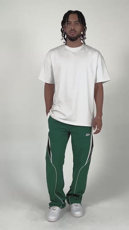 model wearing the hunter green menlo nylon pants